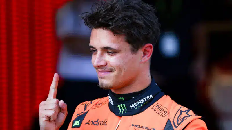 Lando Norris points his finger up after qualifying on pole for the 2025 F1 Austrian Grand Prix