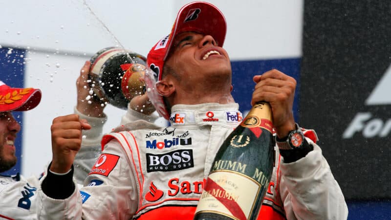 Nick Heidfeld sprays Lewis Hamilton with champagne after the McLaren driver won in F1 for the first time at the 2007 Canadian Grand Prix