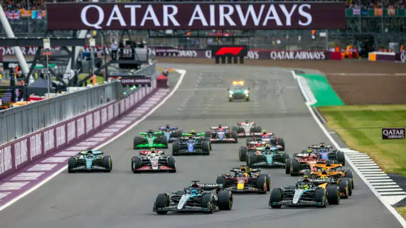 Mercedes drivers George Russell and Lewis Hamilton take the lead into the first corber after the start of the 2024 British Grand Prix