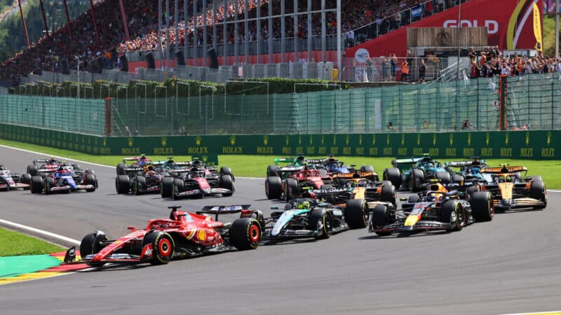 Charles Leclerc (Ferrari) leads the field into the first corner after the start of the 2024 Belgian Grand Prix