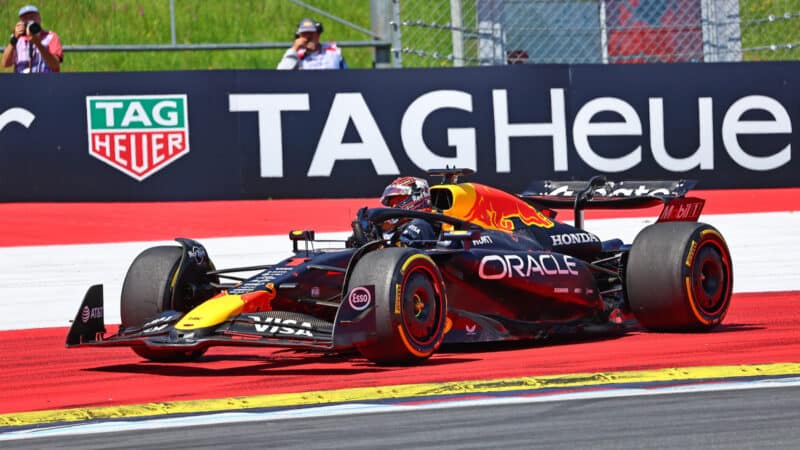 Max Verstappens climbs out of his Red Bull-Honda after the first lap crash during the 2025 Austrian Grand Prix