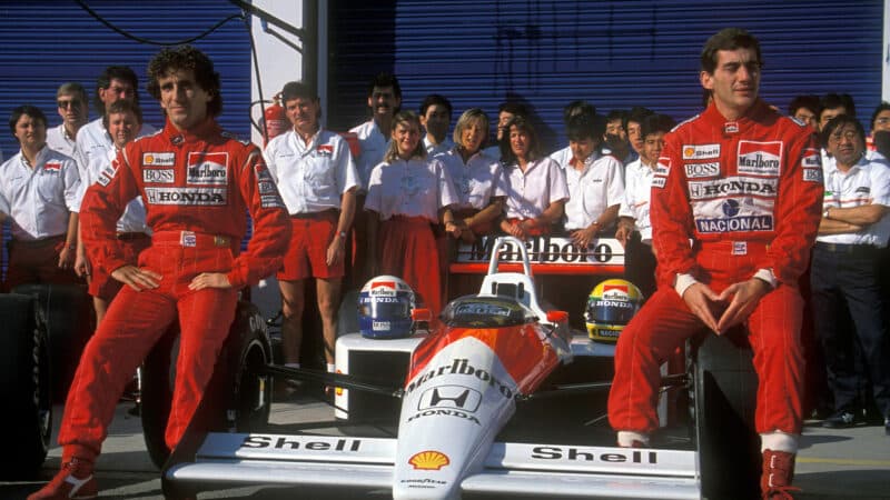 Ayrton Senna and Alain Prost in McLaren team photo with 1988 McLaren F1 car
