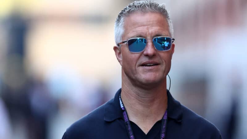 Ralf Schumacher looks on in the Paddock