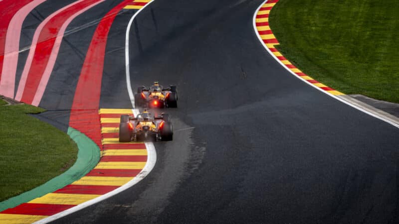 Oscar Piastri prepares to pass Lando Norris at the Belgian GP