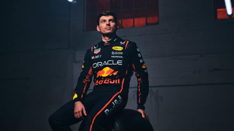 Max Verstappen sits on F1 tyre in Red Bull racesuit for photoshoot before the 2025 season