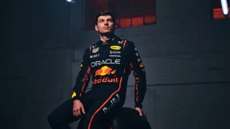 Max Verstappen sits on F1 tyre in Red Bull racesuit for photoshoot before the 2025 season