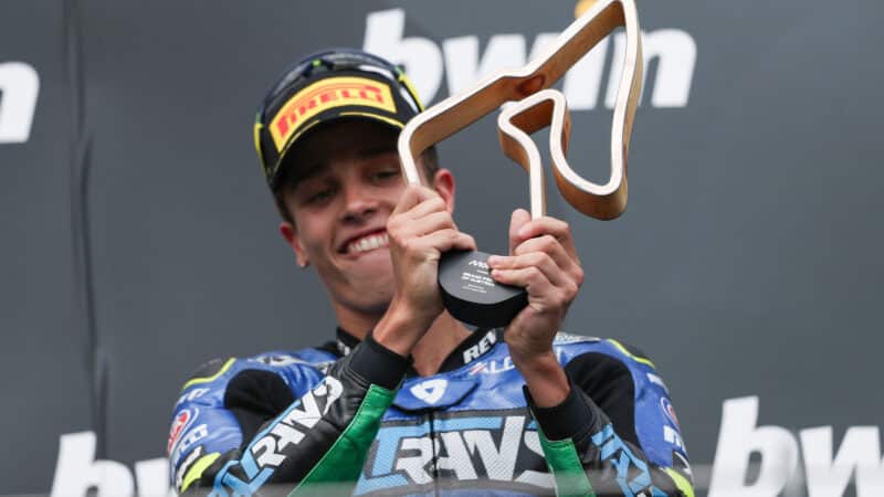 Diogo Moreira holds winners trophy from 2025 Moto2 round at Red Bull Ring