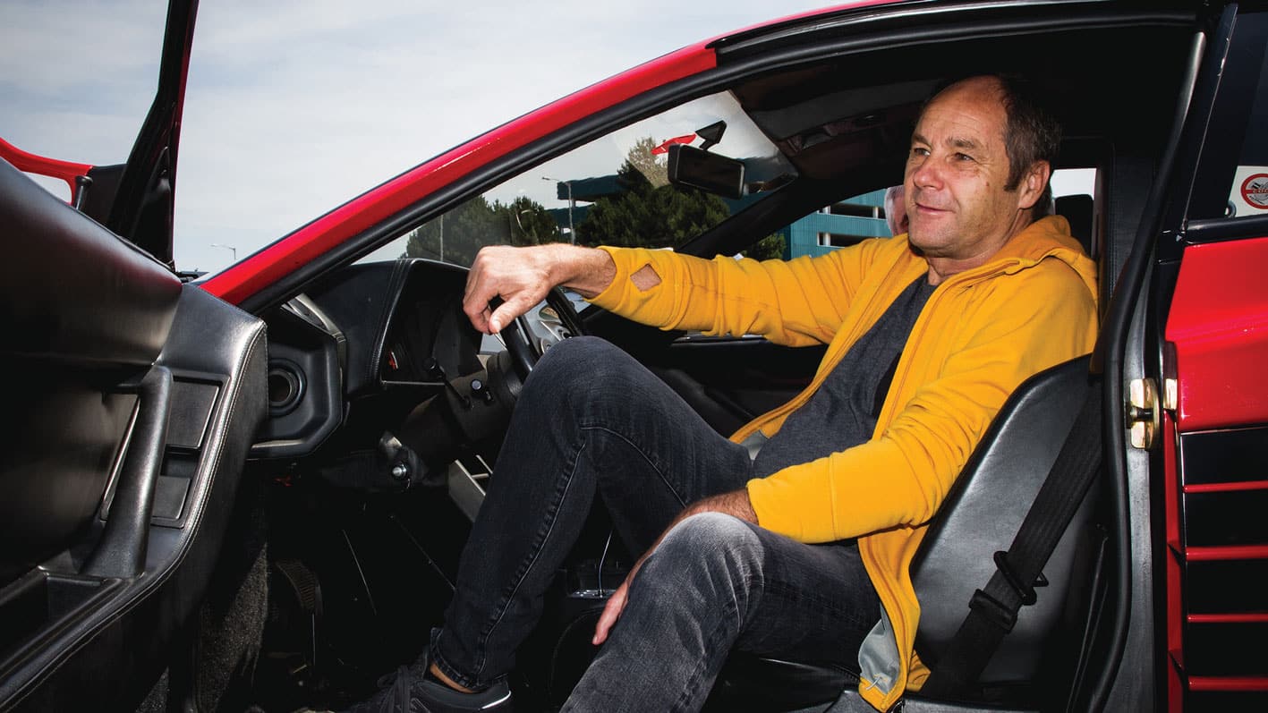 James-Gibson sits in car