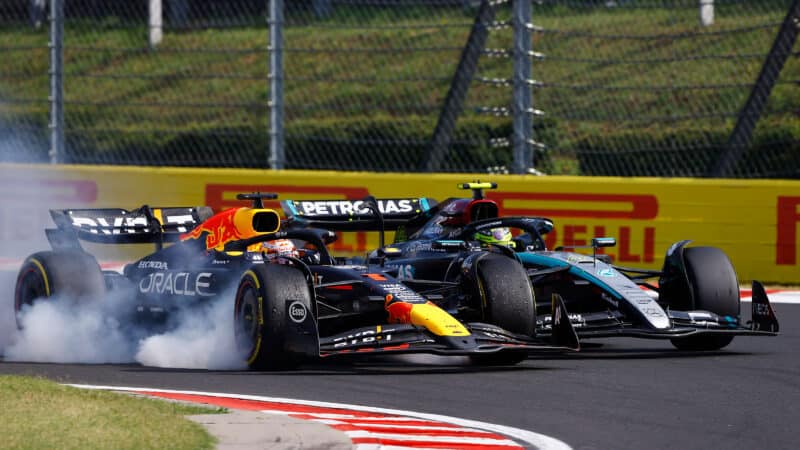 Max Verstappen locks up as he drives alongside Lewis Hamilton in the 2024 F1 Hungarian Grand Prix