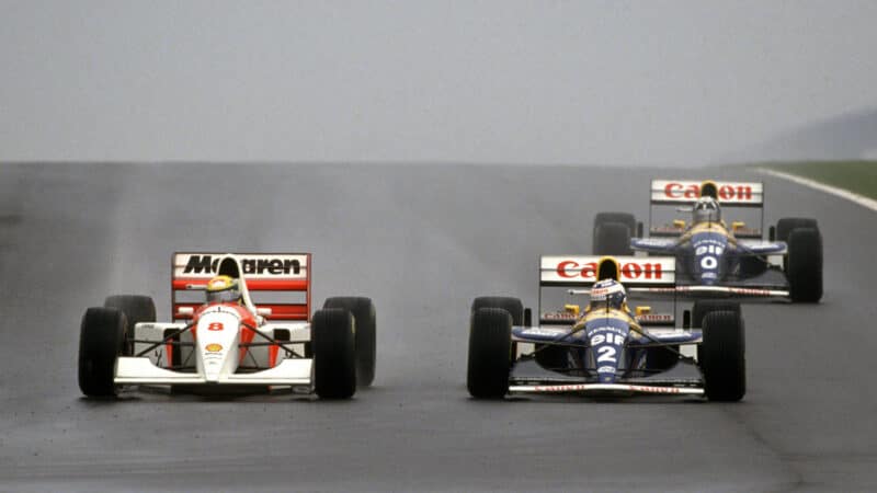 Ayrton Senna (McLaren-Ford) takes the lead from Alain Prost (Williams-Renault) at the end of the first lap in the wet 1993 European Grand Prix