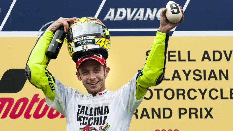 Valentino Rossi holds egg carrying the number nine on the podium at the 2009 MotoGP Malaysian Grand Prix