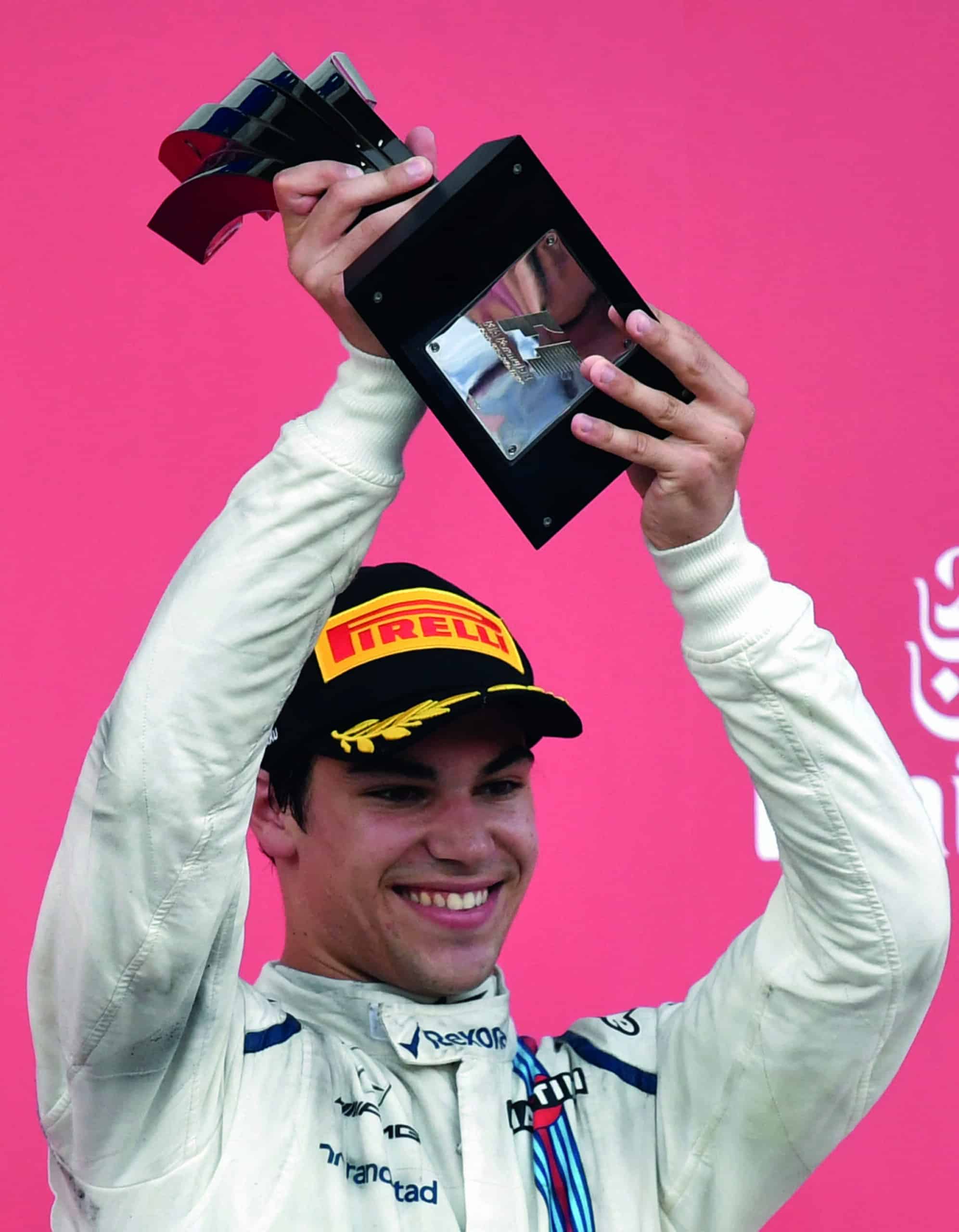 Lance Stroll holding trophy