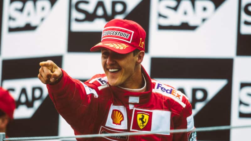 Michael Schumacher points to crowd on the Indianapolis podium after winning the 2000 F1 US Grand Prix