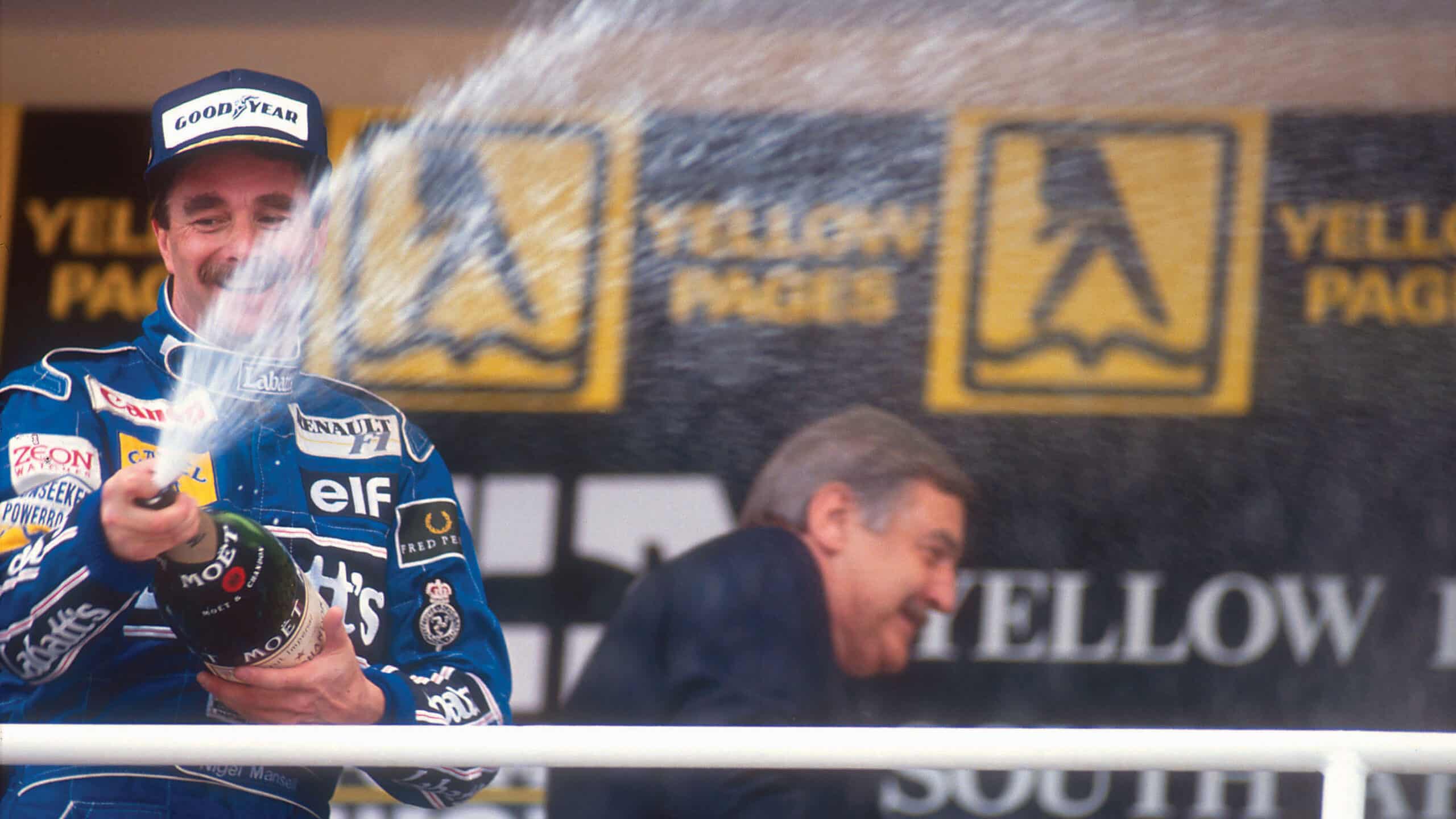 Nigel Mason spraying champagne