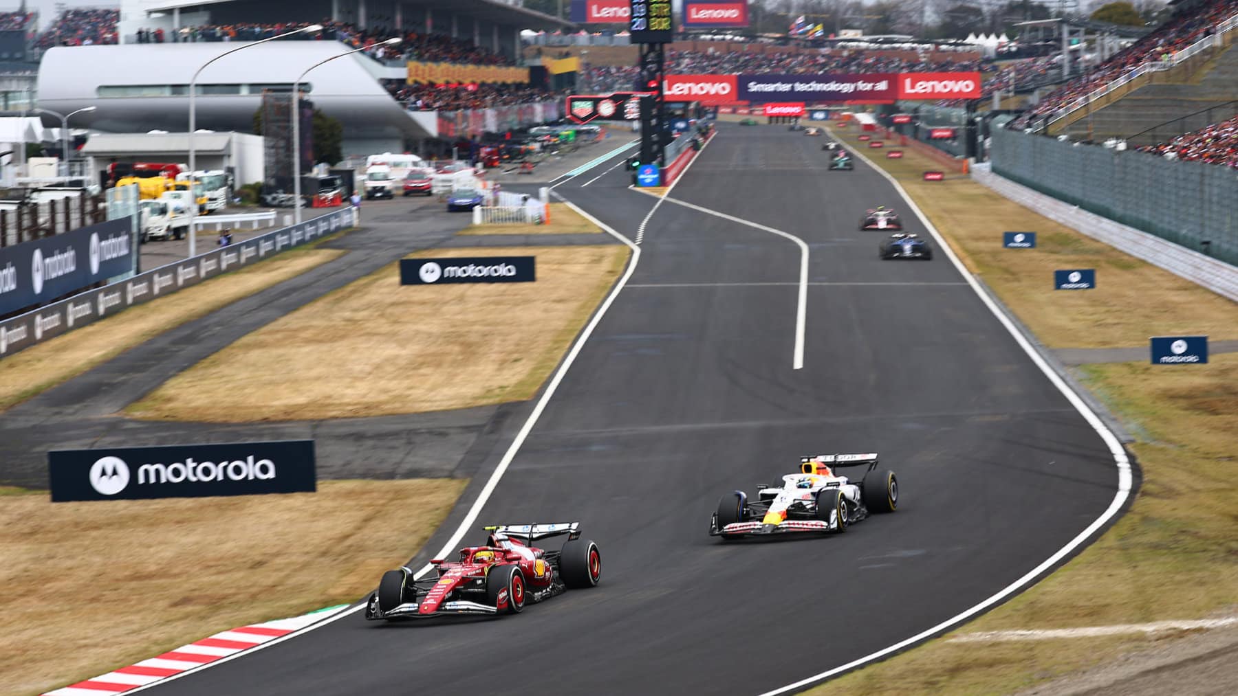 Lewis Hamilton (Ferrari) and Pierre Gasly (Racing Bulls-Honda) during the 2025 Japanese Grand Prix