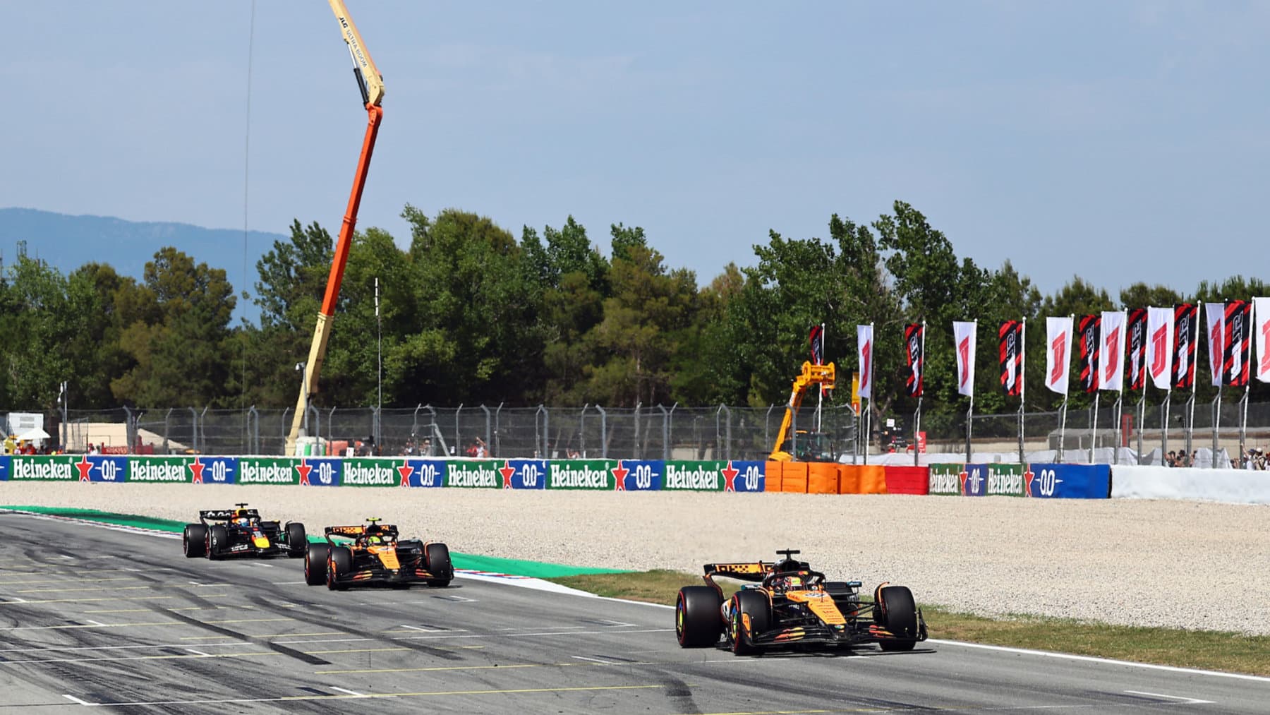 Oscar Piastri leads McLaren-Mercedes teammate Lando Norris and Max Verstappen (Red Bull-Honda) in the 2025 Spanish Grand Prix