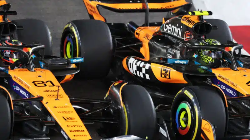 Oscar Piastri and Lando Norris battle for track position at the start of the Singapore GP