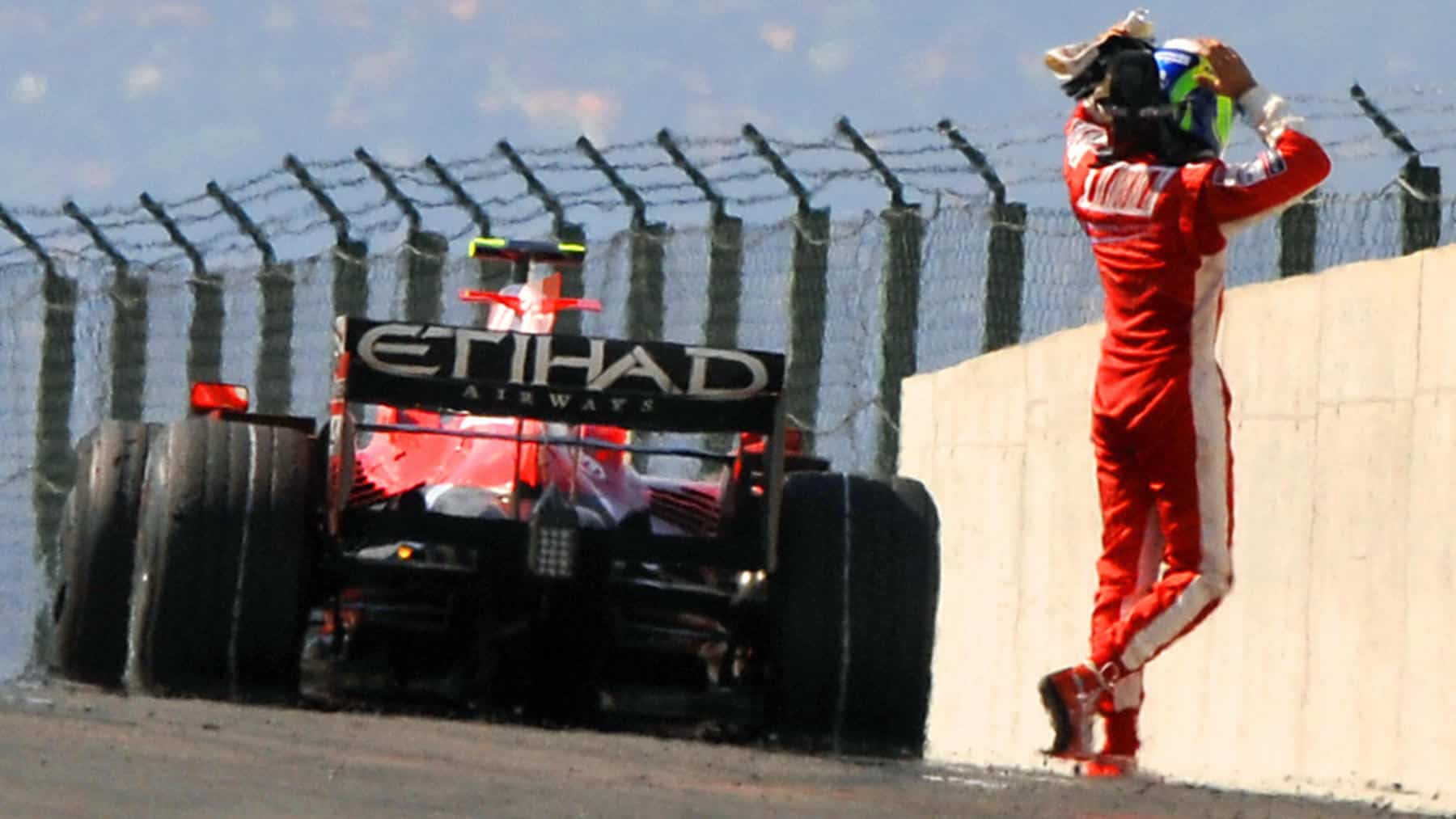 Ferrari Brazilian's driver Felipe Massa reacts as he leaves his car after his engine brakes at the <a href=