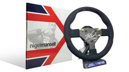 The signature store Nigel Mansell-signed book and full-size fW14B steering wheel