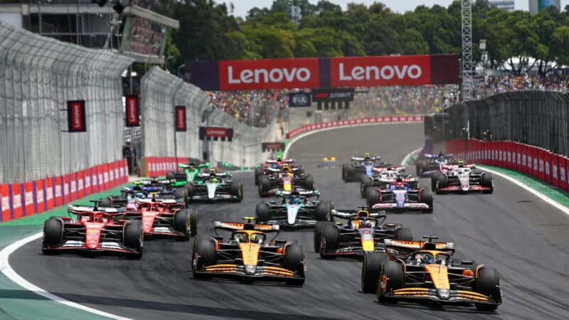 McLaren-Honda drivers Oscar Piastri and Lando Norris lead the field into the first corner of the sprint race before the 2024 Brazilian Grand Prix