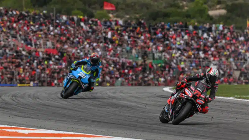 Marco Bezzecchi leads Raul Fernandez in front of a packed house at Valencia on Sunday