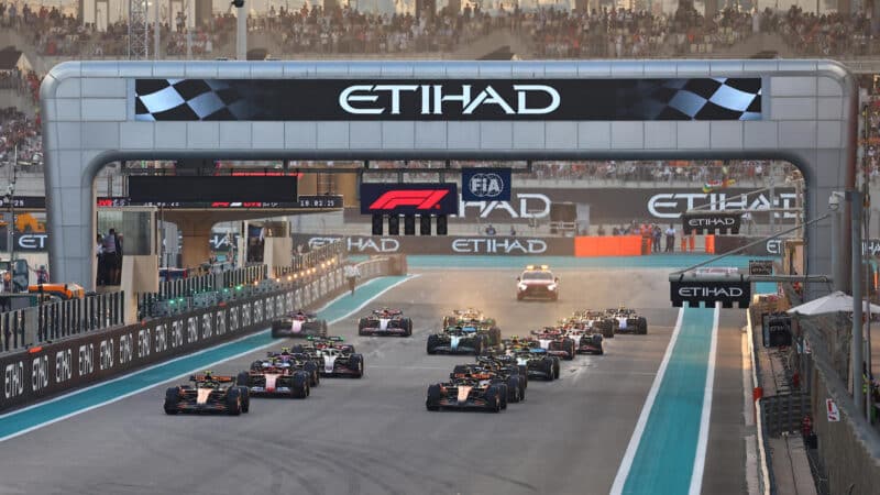 McLaren-Mercedes drivers Lando Norris and Oscar Piastri lead the field at the start of the 2024 Abu Dhabi Grand Prix
