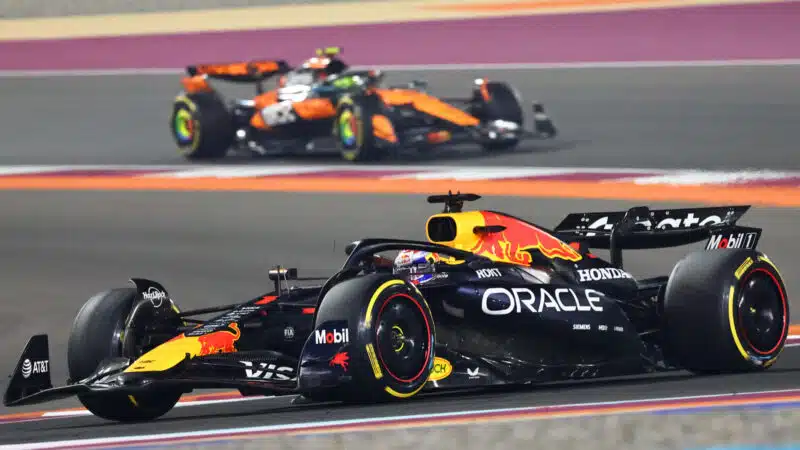 Max Verstappen (Red Bull-Honda) leads Lando Norris (McLaren-Mercedes) during the 2025 Qatar Grand Prix