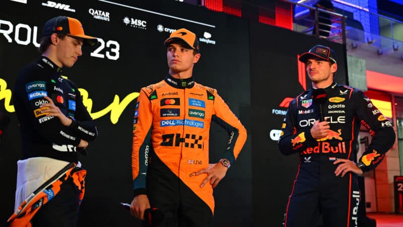 Max Verstappen stands with Lando Norris and Oscar Piastri at the 2023 F1 Qatar Grand Prix